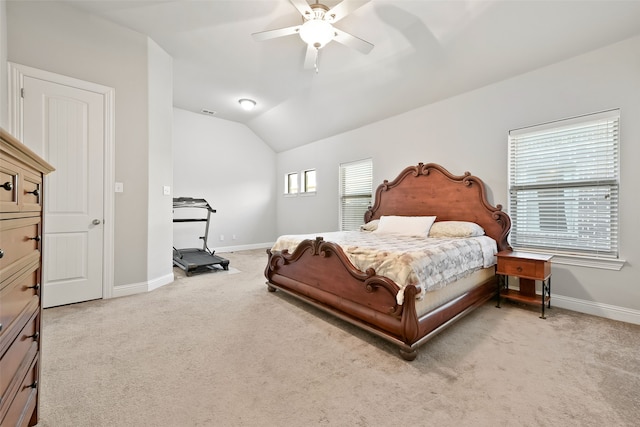 carpeted bedroom with lofted ceiling and ceiling fan