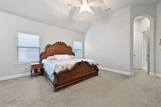 carpeted bedroom with ceiling fan and lofted ceiling