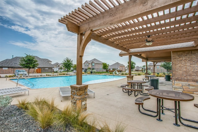 view of pool with a pergola and a patio