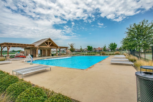 view of swimming pool featuring a patio area