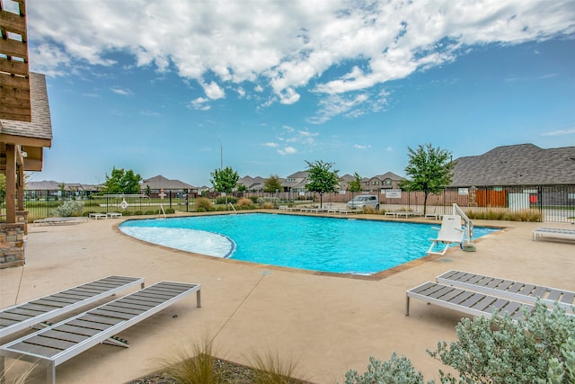 view of swimming pool with a patio area