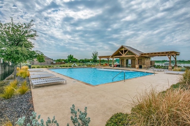 view of pool featuring a patio area