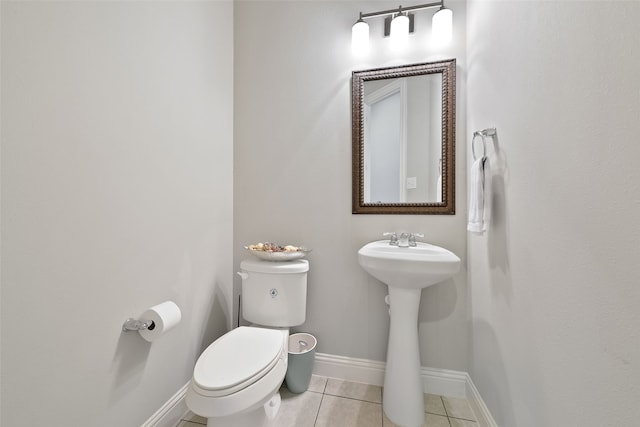 bathroom featuring toilet and tile patterned floors