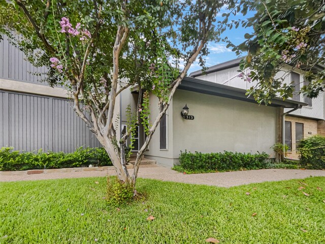 313 Oak Shadow Cir, Bedford, TX 76021 - view of side of property featuring a lawn and stucco siding