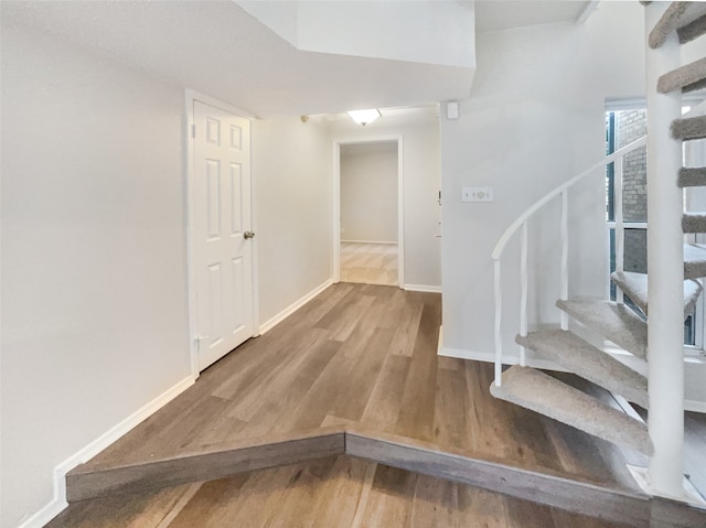 stairs with wood-type flooring