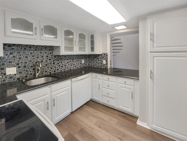 313 Oak Shadow Cir, Bedford, TX 76021 - kitchen featuring a sink, backsplash, light wood-style floors, white cabinetry, and white dishwasher