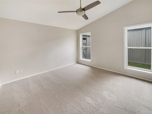 313 Oak Shadow Cir, Bedford, TX 76021 - carpeted spare room with vaulted ceiling, a ceiling fan, and baseboards