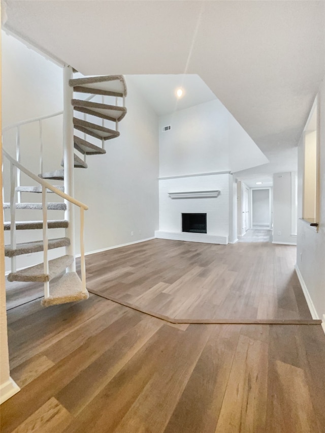 unfurnished living room with hardwood / wood-style floors