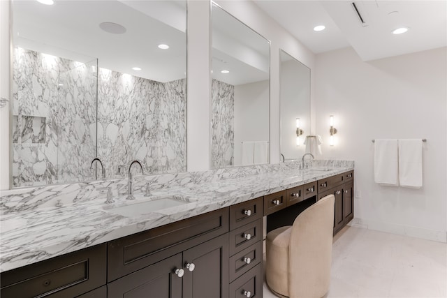 bathroom featuring tile walls and vanity