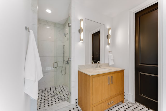 bathroom with vanity, tile patterned floors, and a shower with shower door