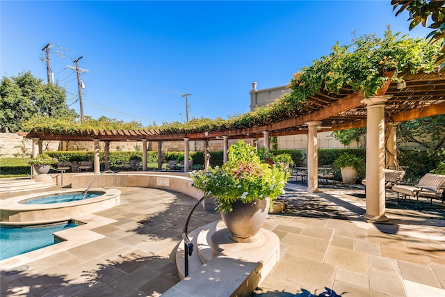 view of patio / terrace featuring a pool with hot tub and a pergola