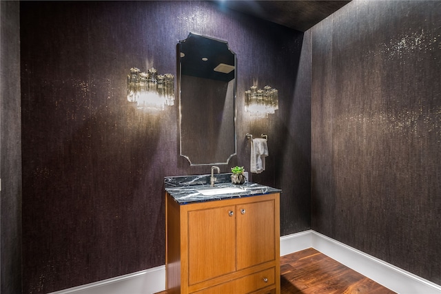 bathroom featuring wood-type flooring and vanity