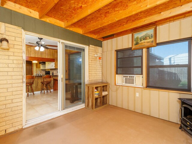 sunroom / solarium with a sink, ceiling fan, and cooling unit