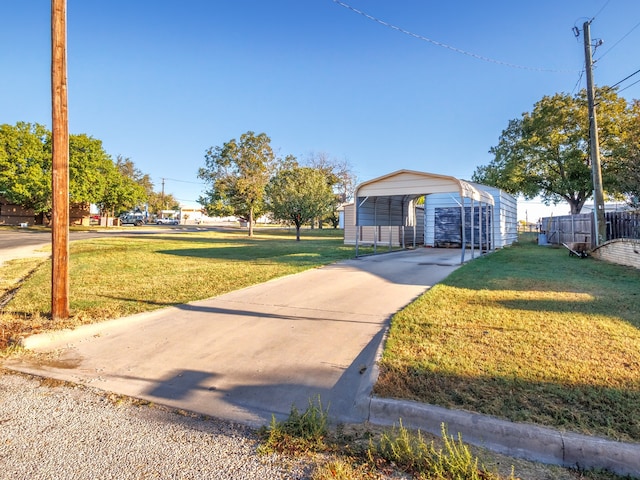 view of front facade with a front lawn and a carport