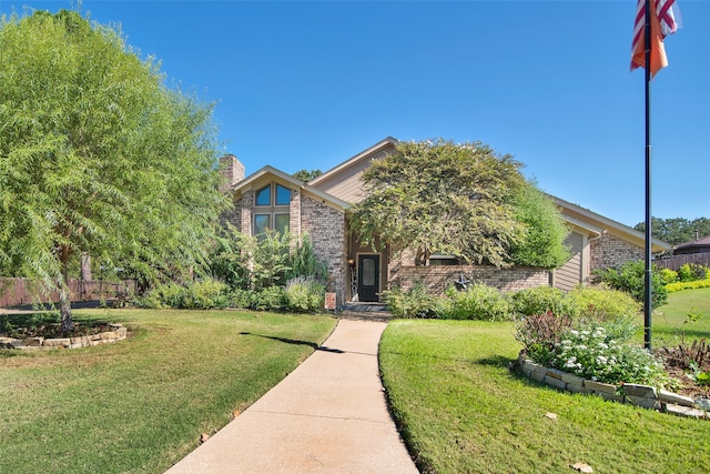 obstructed view of property featuring a front yard