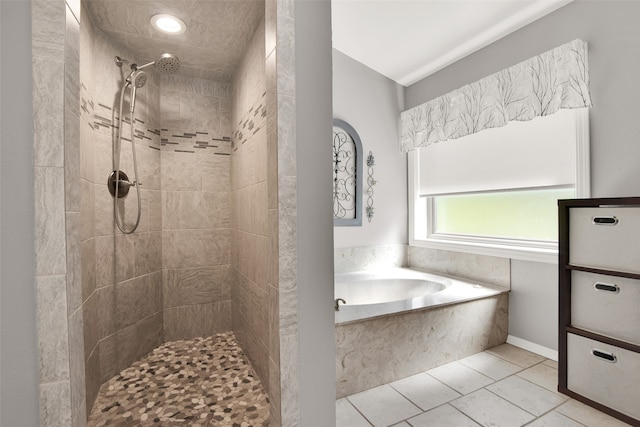 bathroom featuring shower with separate bathtub and tile patterned flooring