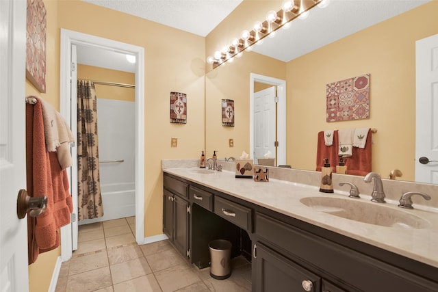 bathroom featuring vanity, shower / tub combo, tile patterned flooring, and a textured ceiling