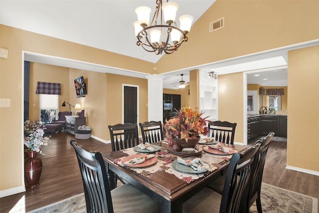 dining space with ceiling fan, dark hardwood / wood-style floors, sink, and high vaulted ceiling