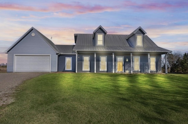 view of front of property with a lawn and a garage