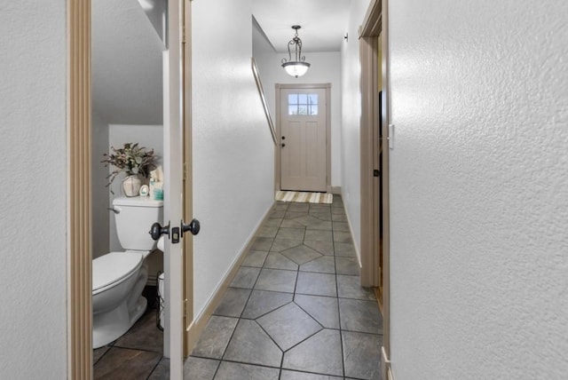 doorway featuring light tile patterned floors