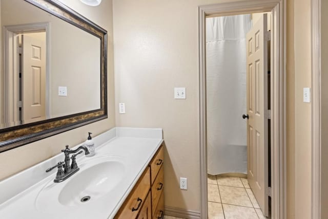 bathroom with tile patterned floors and vanity