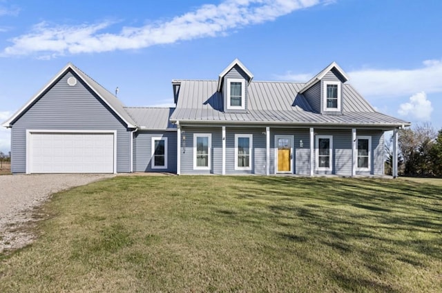 view of front of property featuring a garage and a front lawn