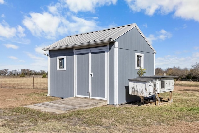 view of outbuilding with a lawn