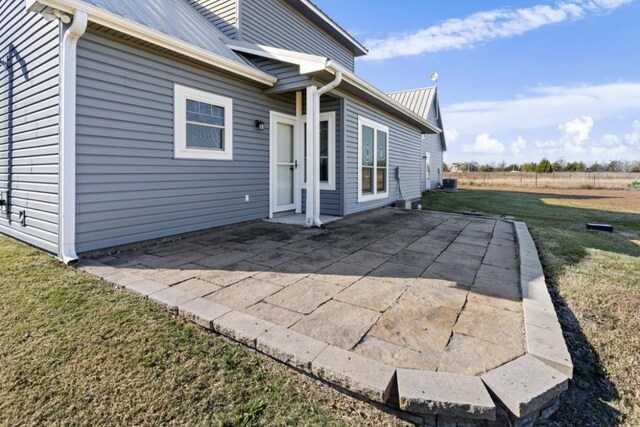 exterior space with a yard and a patio