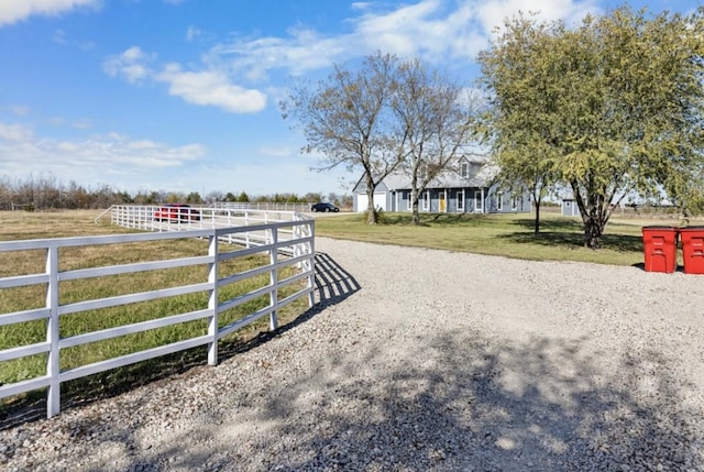 view of yard with a rural view