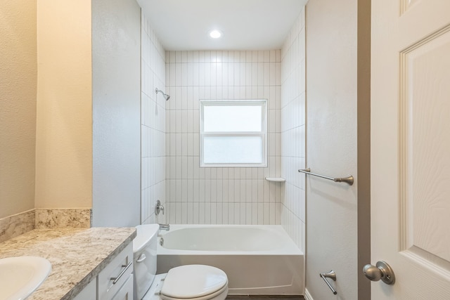 full bathroom with vanity, toilet, and tiled shower / bath