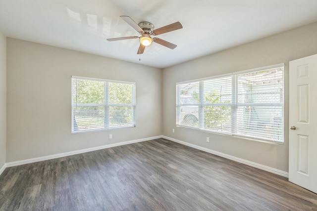 unfurnished bedroom featuring ceiling fan and dark hardwood / wood-style flooring