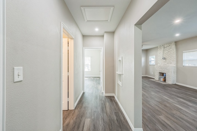 corridor featuring dark wood-type flooring