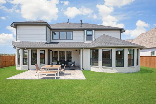 back of house featuring a lawn, outdoor lounge area, and a patio area