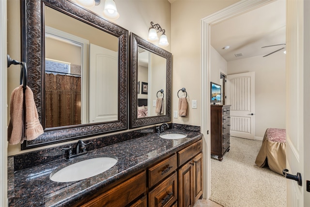 bathroom with ceiling fan and vanity