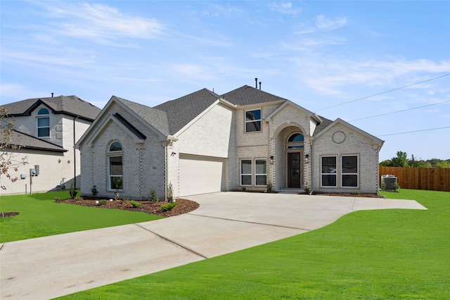 french country home featuring a front lawn