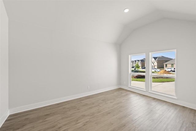 interior space with vaulted ceiling and hardwood / wood-style floors