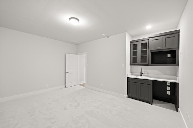 interior space with light carpet and sink