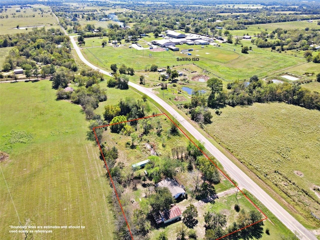 birds eye view of property featuring a rural view