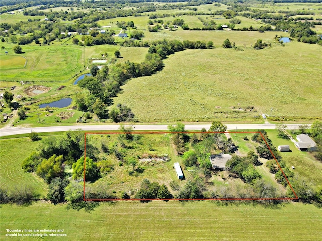 aerial view featuring a rural view and a water view