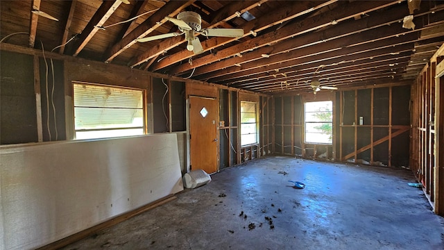 misc room with ceiling fan and concrete floors