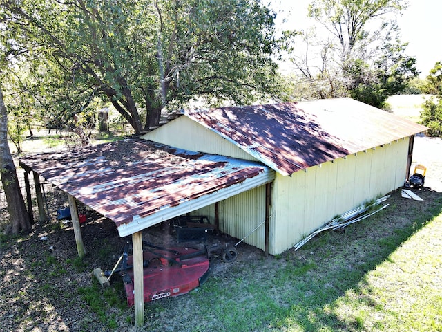 view of outbuilding featuring a yard