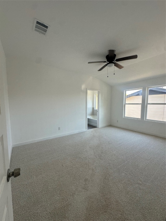 unfurnished room with lofted ceiling, carpet flooring, and ceiling fan