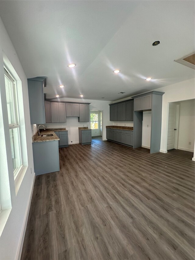 kitchen featuring dark hardwood / wood-style floors, sink, and gray cabinetry