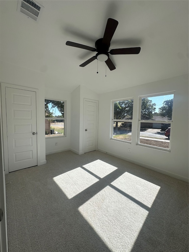 unfurnished bedroom featuring carpet flooring and ceiling fan