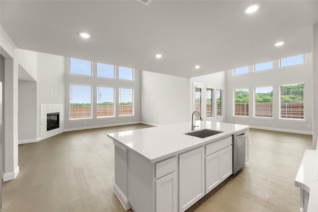 1008 Roys Dr, Rockwall, TX 75087 - kitchen featuring open floor plan, a sink, dishwasher, recessed lighting, and light countertops