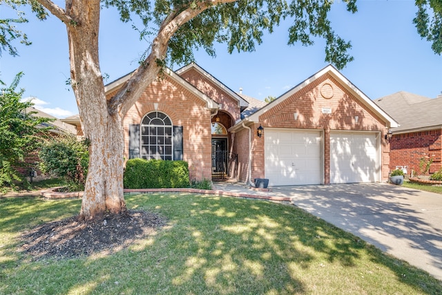 view of front facade with a front yard and a garage