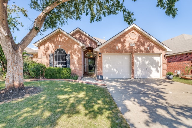 view of front of home featuring a garage and a front yard