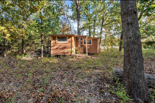 rear view of house with a shed