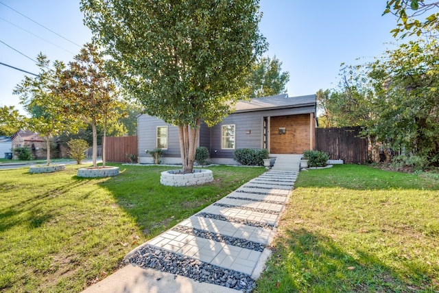 view of front of property with a front lawn