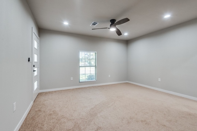 unfurnished room featuring ceiling fan and carpet floors